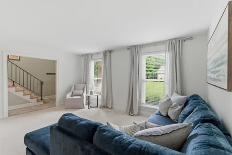 a living room with a couch and a window