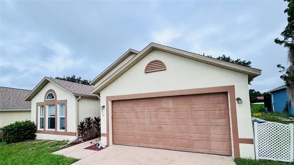 a front view of a house with garage