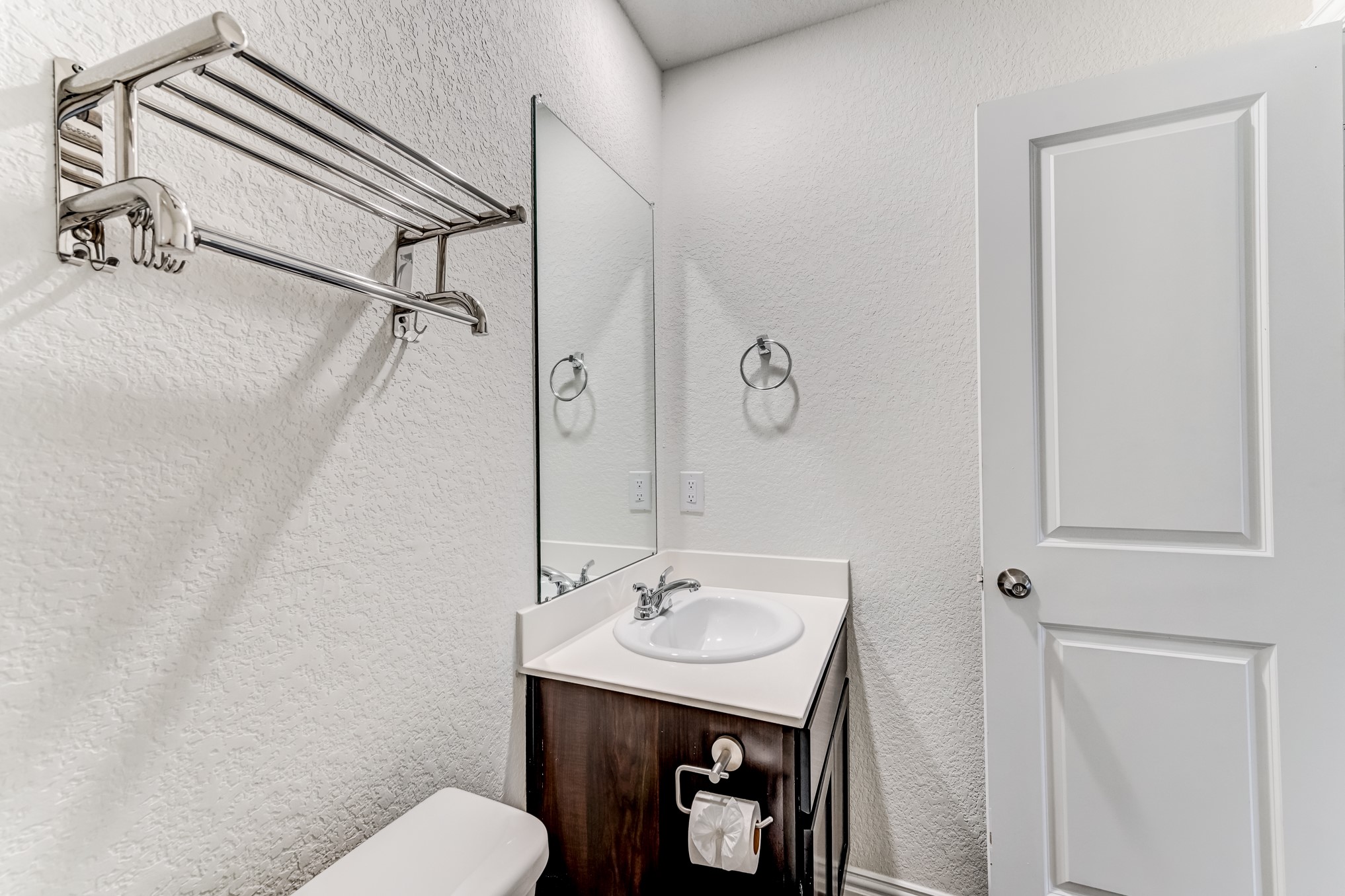 7925 Way Street, Unit A Houston, TX 77028 - Photo 17 of 29 a bathroom with a toilet a sink and mirror