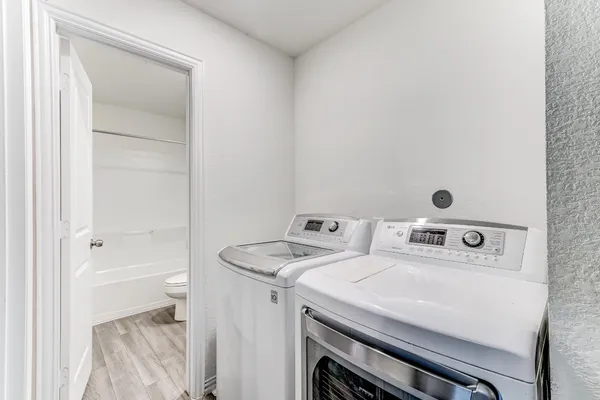 a utility room with dryer and washer