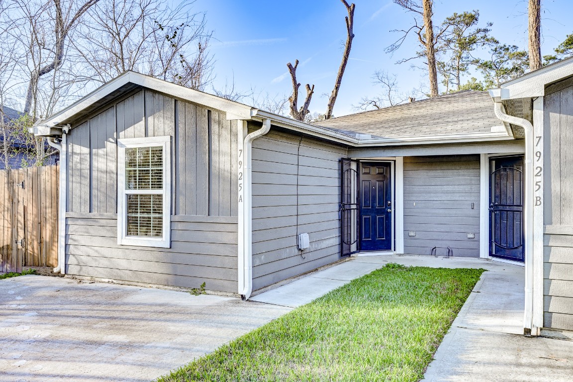 7925 Way Street, Unit A Houston, TX 77028 - Photo 2 of 29 a view of a house with a small yard and wooden fence