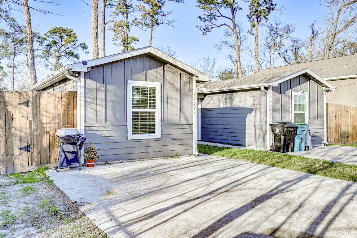 7925 Way Street, Unit A Houston, TX 77028 - Photo 3 of 29 a front view of a house with a yard