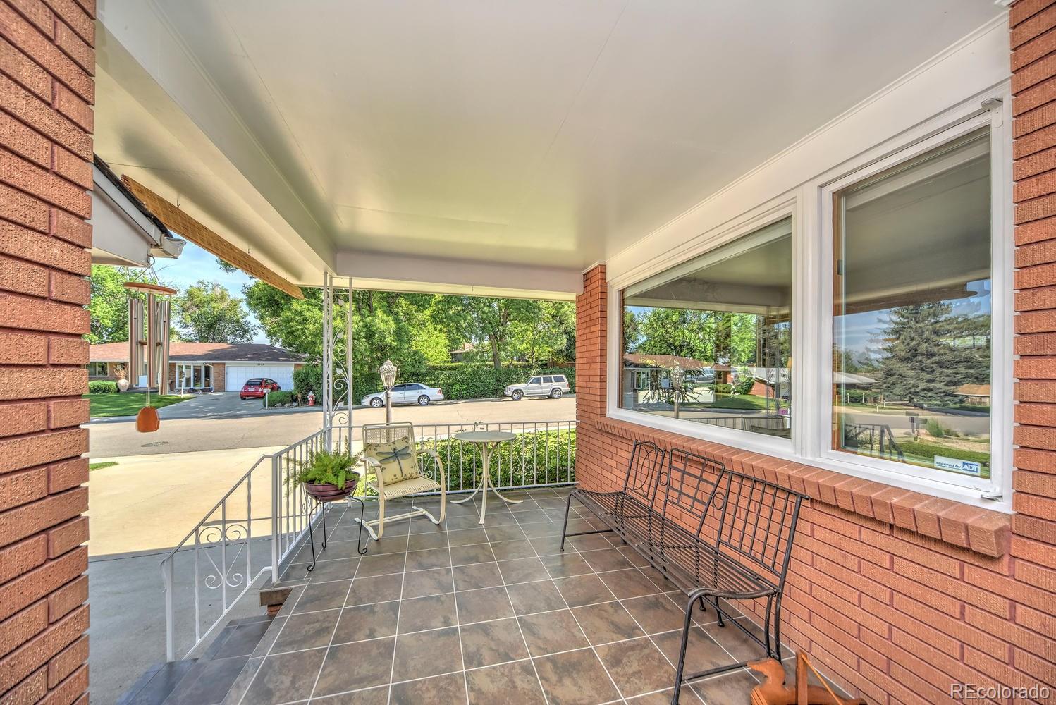 2219 Riviera Place Longmont, CO 80501 - Photo 11 of 19 a view of a patio with dining table and chairs