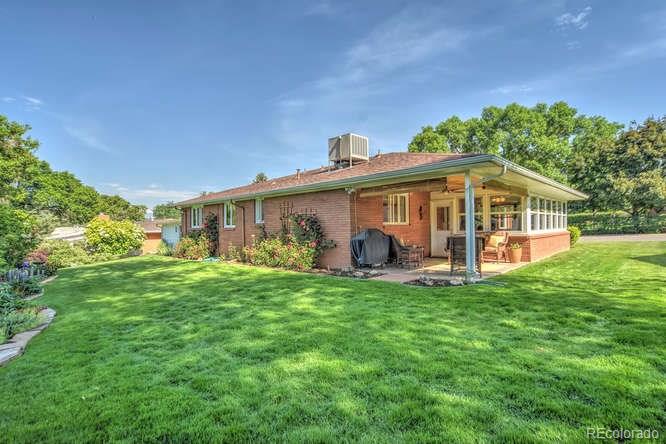 2219 Riviera Place Longmont, CO 80501 - Photo 19 of 19 a view of a house with a yard and sitting area