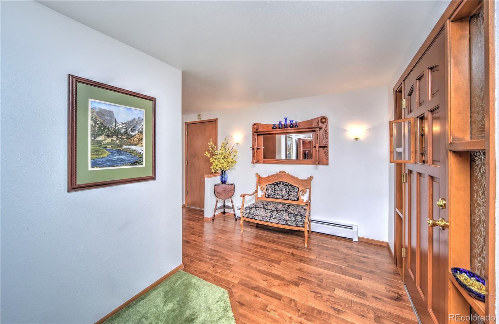 2219 Riviera Place Longmont, CO 80501 - Photo 2 of 19 a view of a livingroom with furniture and workspace
