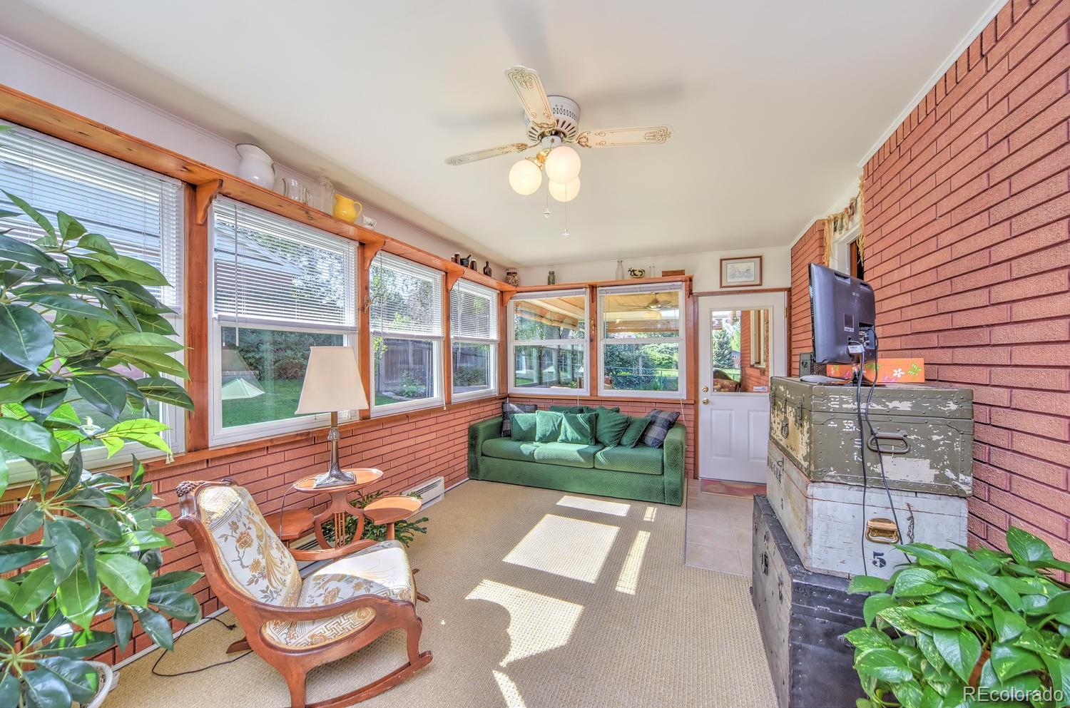 2219 Riviera Place Longmont, CO 80501 - Photo 9 of 19 a building outdoor space with patio furniture and potted plants