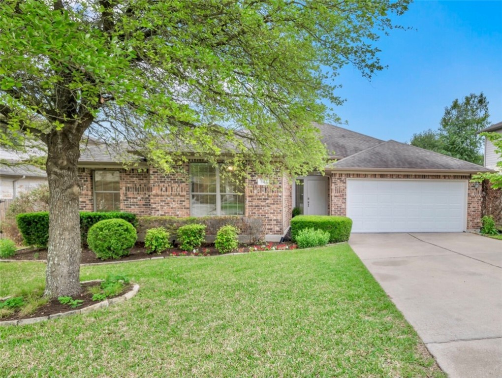 7313 Moon Rock Road Austin, TX 78739 - Photo 1 of 1 front view of a house with a yard