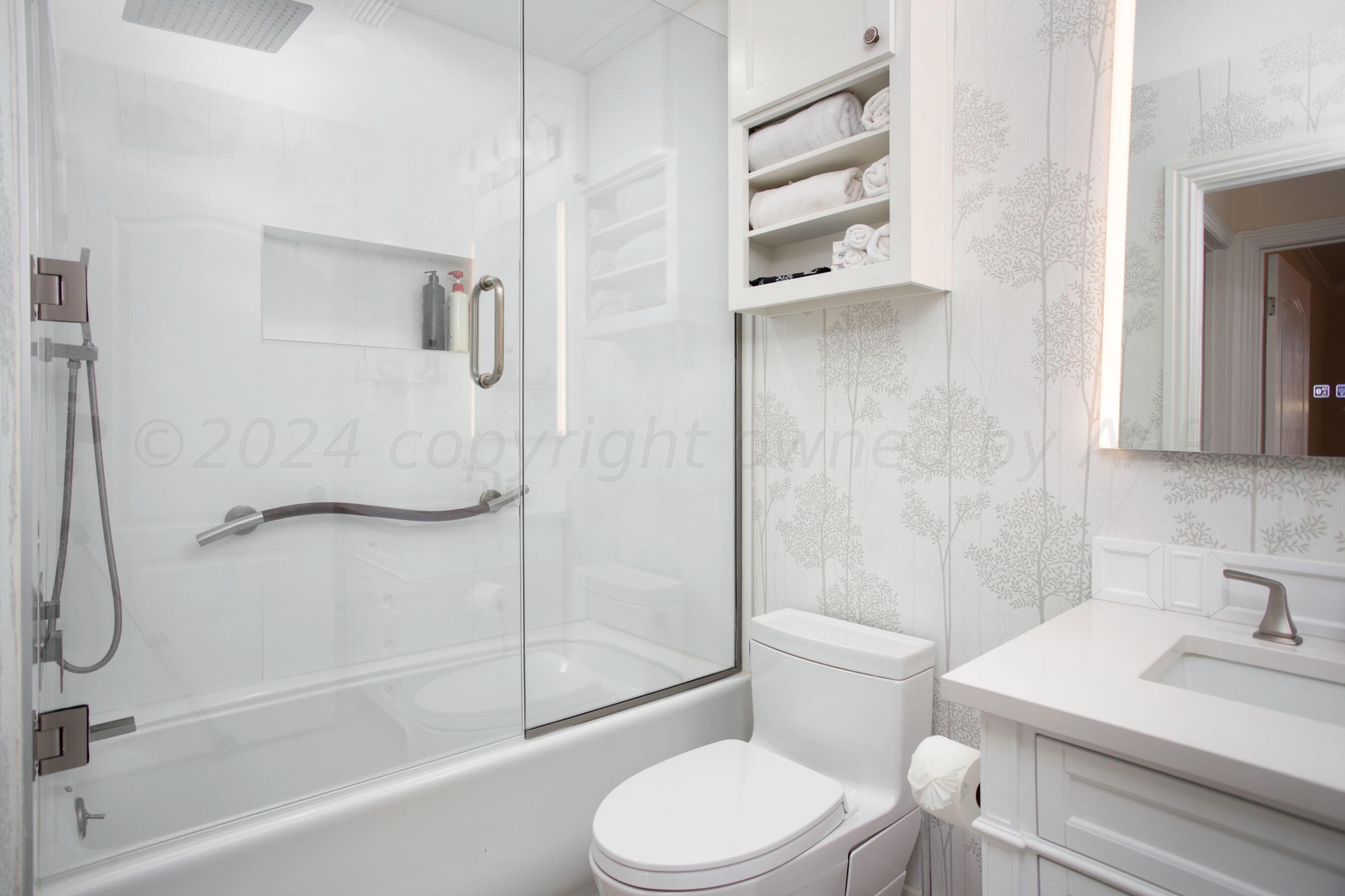6921 Thunder Road Amarillo, TX 79119 - Photo 17 of 28 a bathroom with a sink toilet and shower