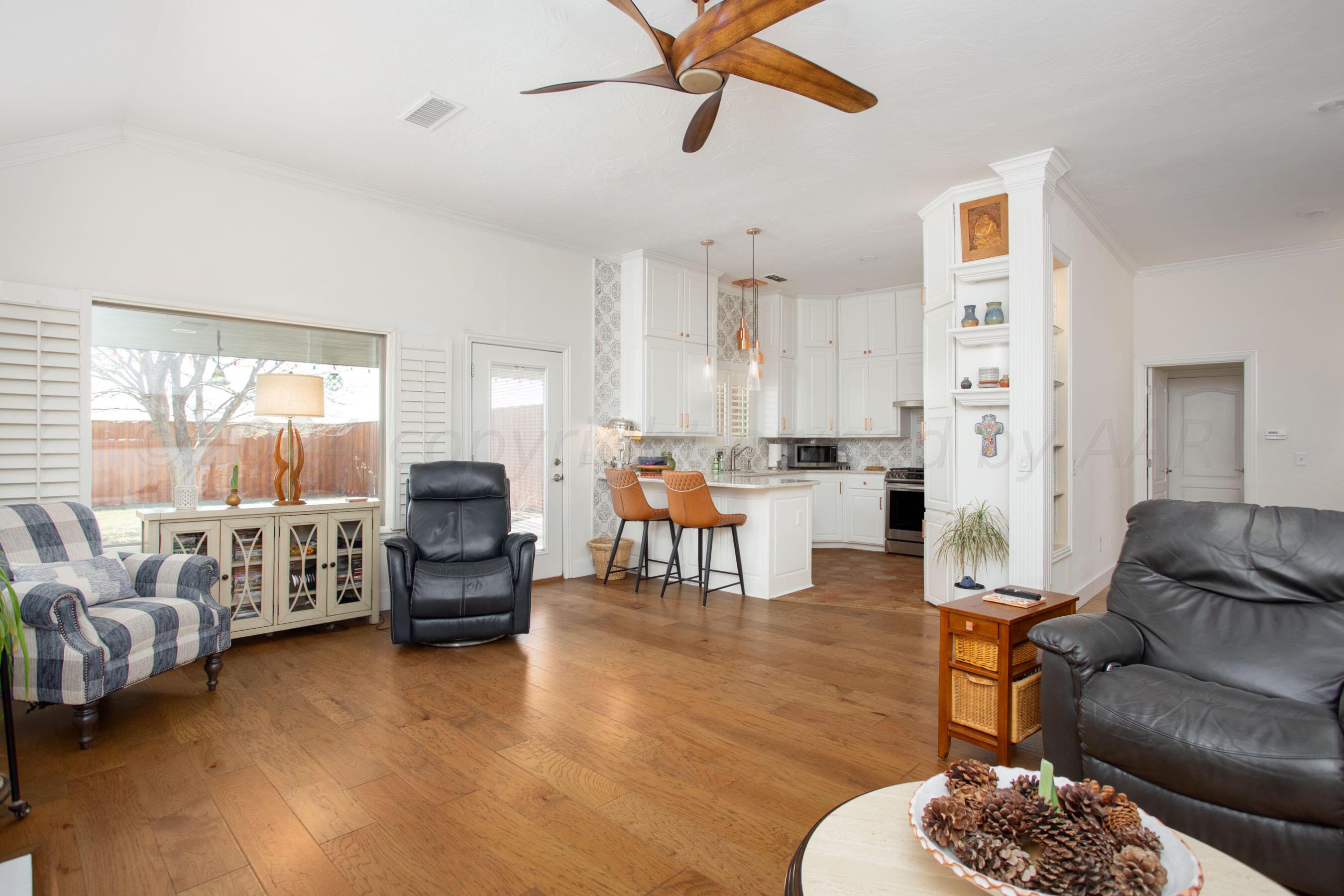 6921 Thunder Road Amarillo, TX 79119 - Photo 6 of 28 a living room with furniture and a large window