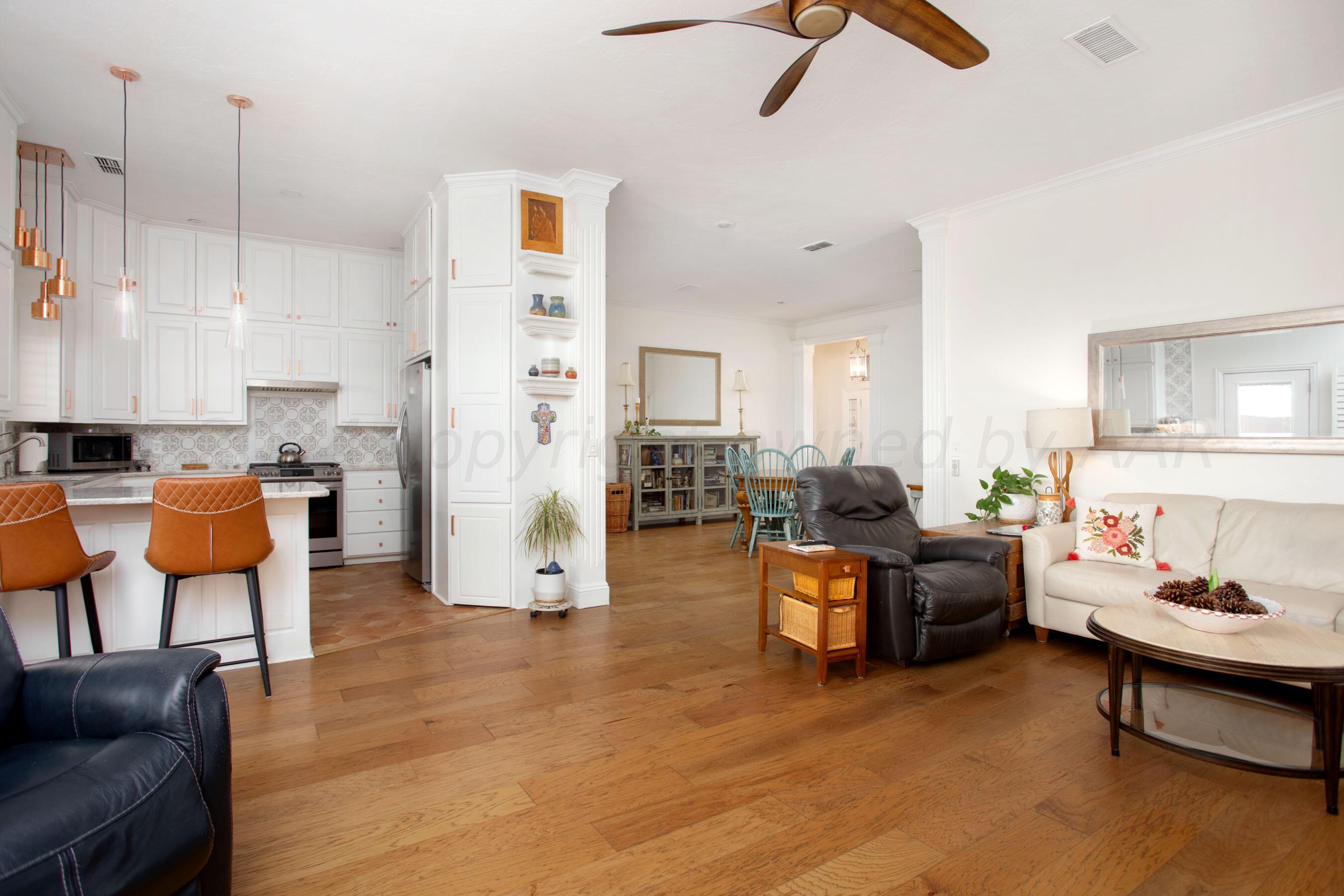 6921 Thunder Road Amarillo, TX 79119 - Photo 10 of 28 a living room with furniture and a wooden floor