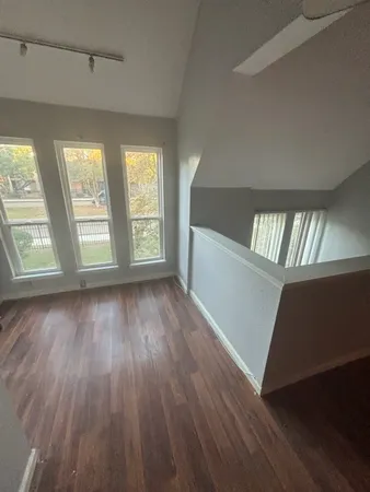 a bathroom with a sink mirror and toilet