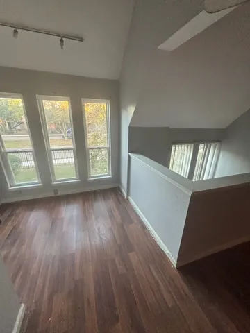 a bathroom with a sink mirror and toilet