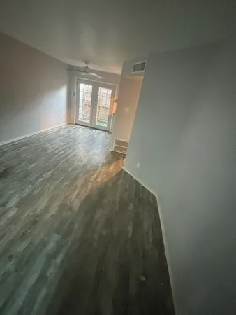 a view of balcony and wooden floor