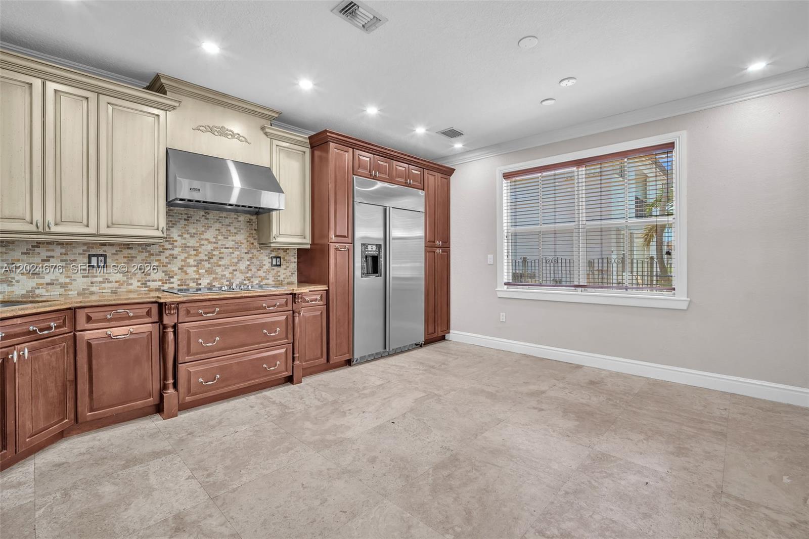 2155 Southwest 156th Court Miami, FL 33185 - Photo 23 of 57 a kitchen with stainless steel appliances granite countertop a stove a sink and a refrigerator