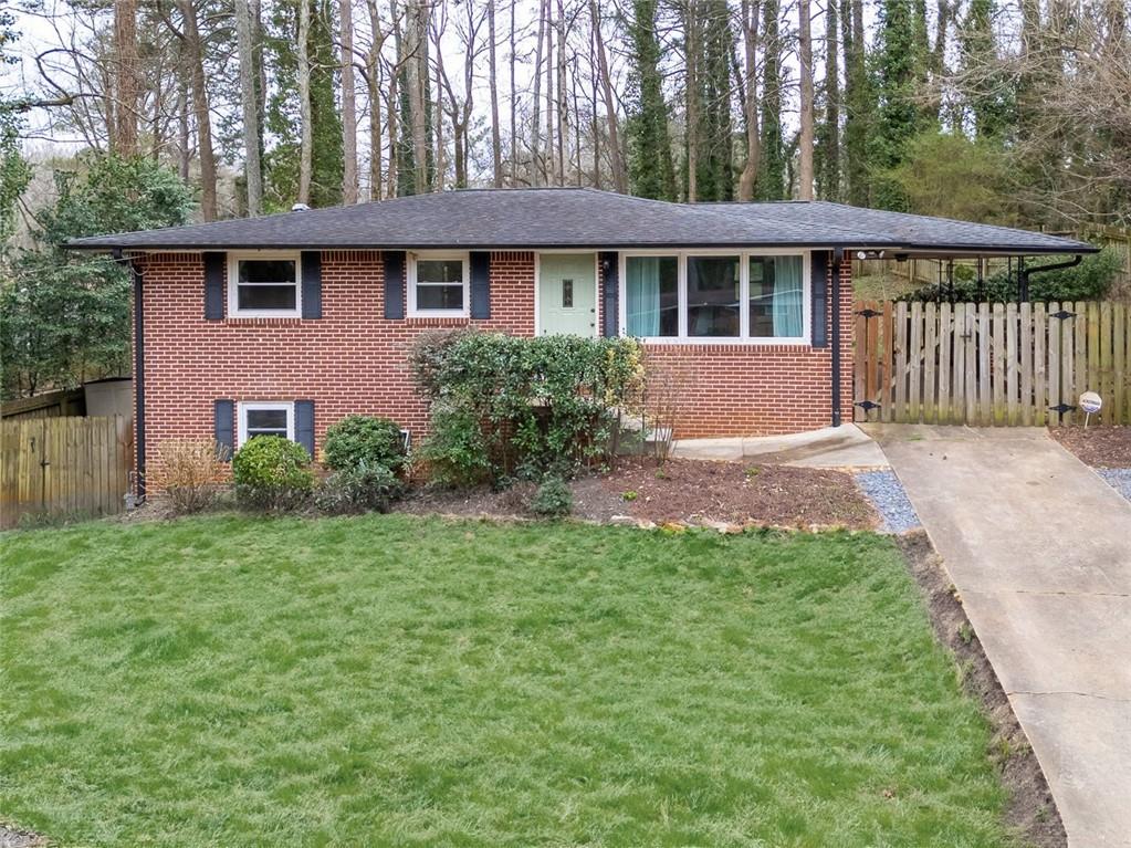 3541 Brookfield Lane Decatur, GA 30032 - Photo 1 of 1 a front view of a house with a garden