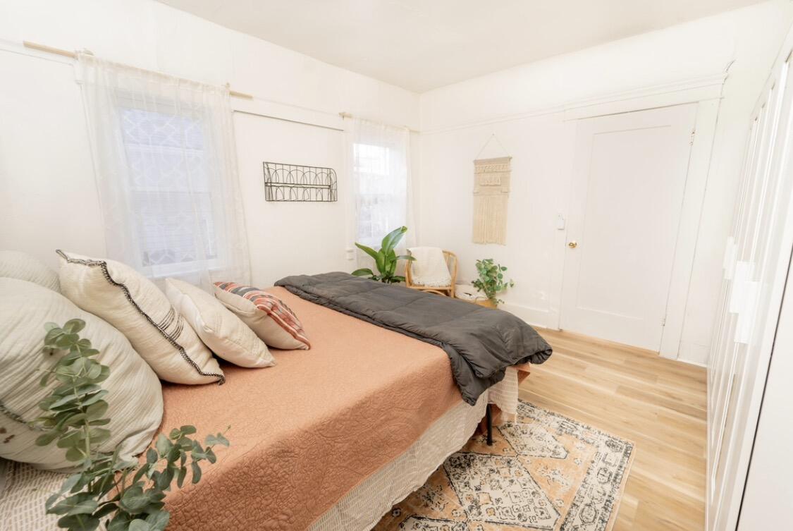 232 Ash Street Exeter, CA 93221 - Photo 11 of 13 a bedroom with a bed and painting on the wall
