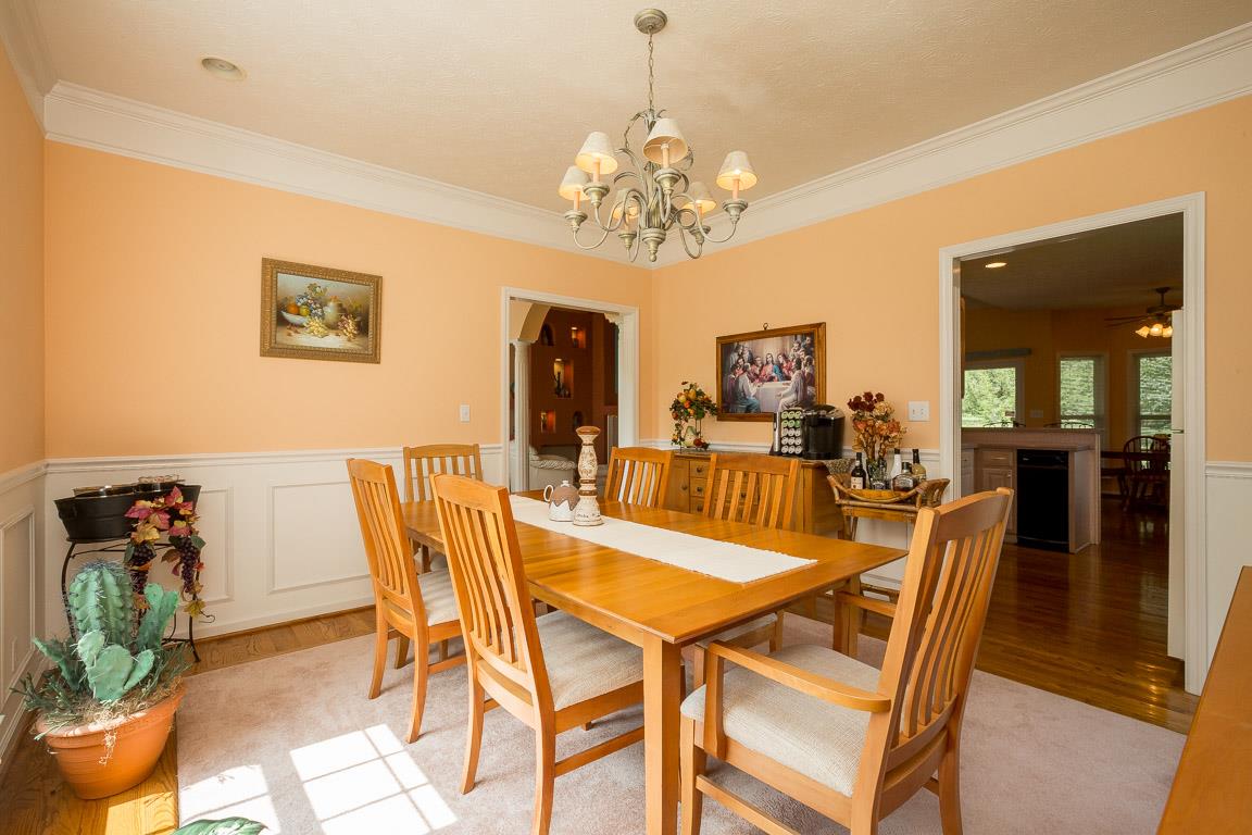 1066 Harkreader Road Mount Juliet, TN 37122 - Photo 16 of 30 a view of a dining room with furniture and chandelier