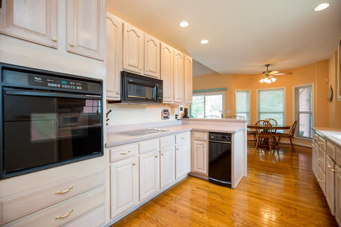 1066 Harkreader Road Mount Juliet, TN 37122 - Photo 17 of 30 a kitchen with stainless steel appliances white cabinets a sink and a stove