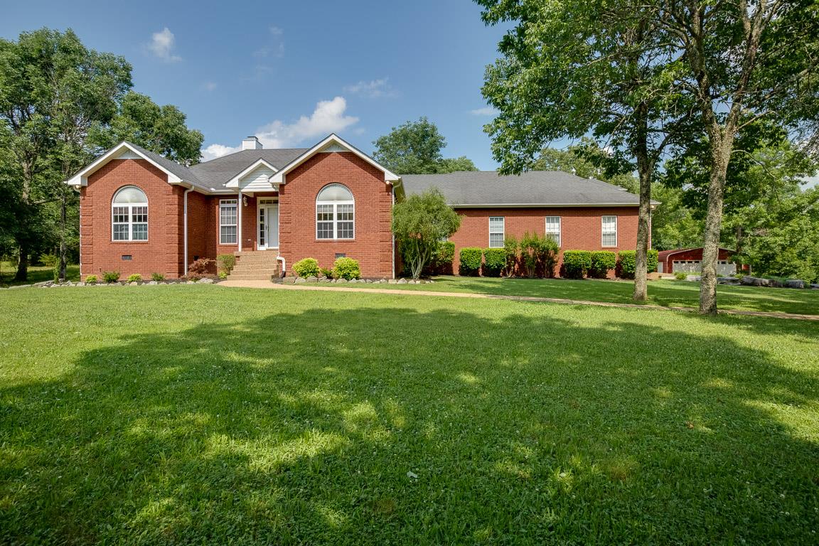 1066 Harkreader Road Mount Juliet, TN 37122 - Photo 2 of 30 a front view of a house with a yard and garage