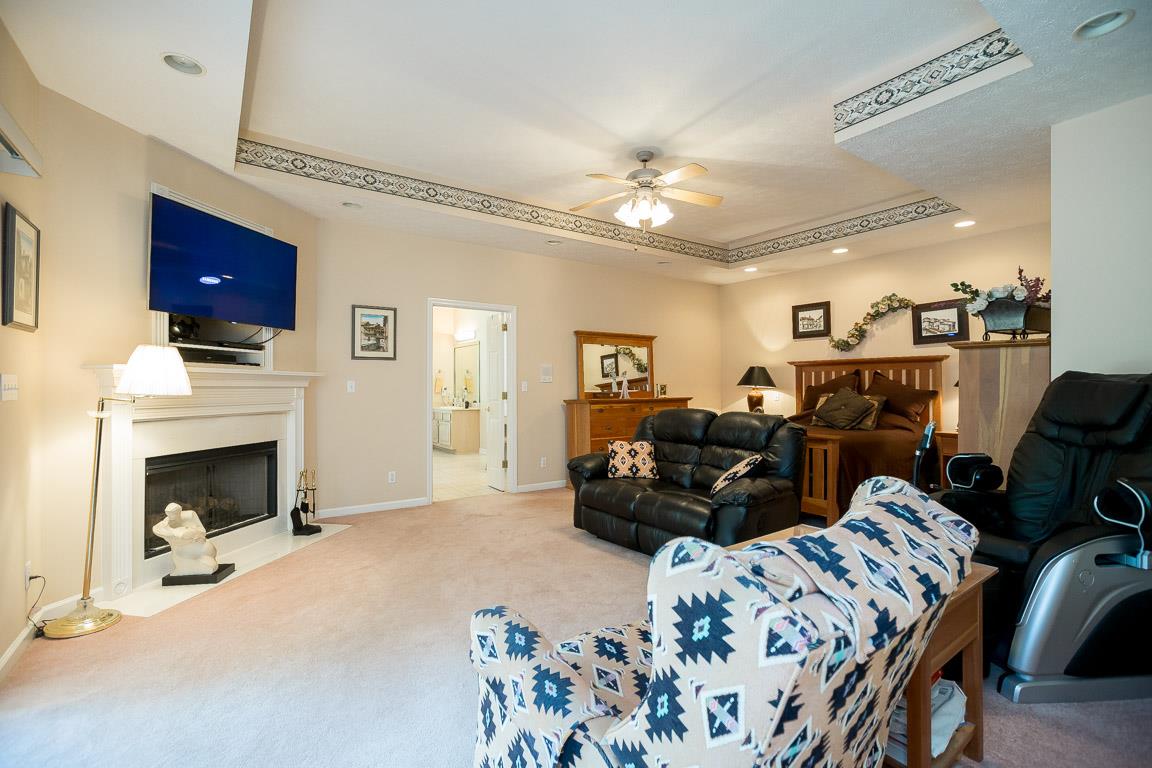 1066 Harkreader Road Mount Juliet, TN 37122 - Photo 21 of 30 a living room with furniture a fireplace and a flat screen tv