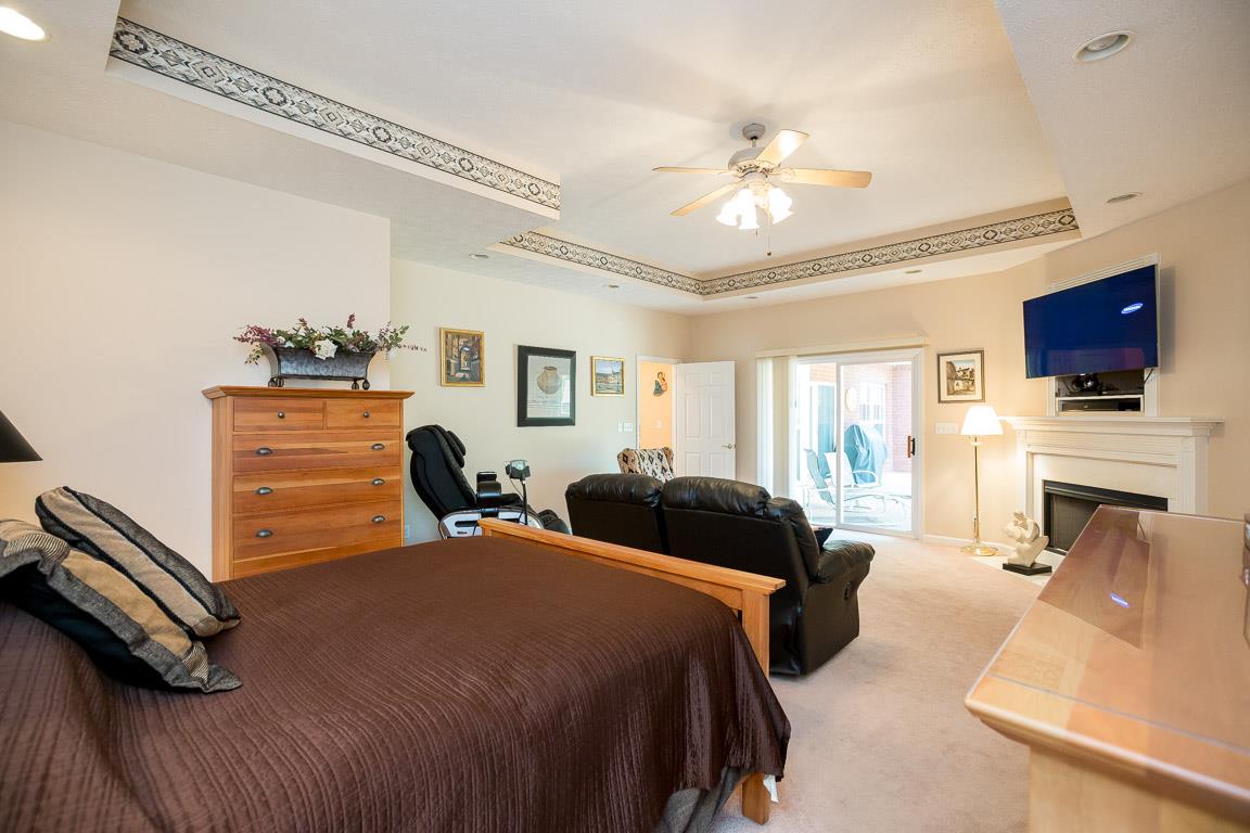 1066 Harkreader Road Mount Juliet, TN 37122 - Photo 22 of 30 a bedroom with a bed and a flat screen tv