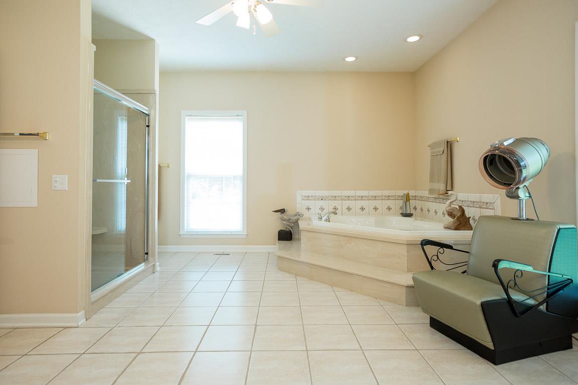1066 Harkreader Road Mount Juliet, TN 37122 - Photo 23 of 30 a spacious bathroom with a mirror and a sink