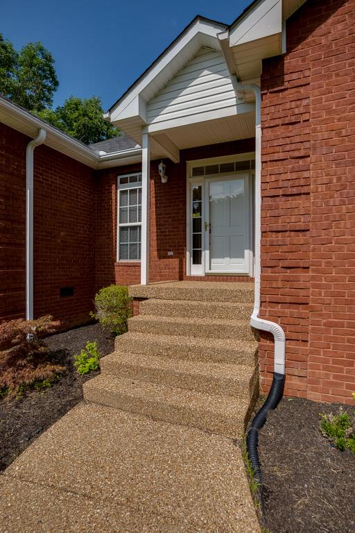 1066 Harkreader Road Mount Juliet, TN 37122 - Photo 10 of 30 a front view of a house with a garden