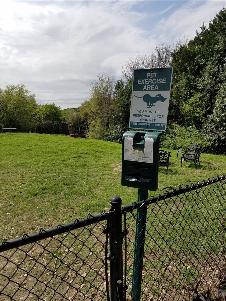 2450 Wickersham Lane, Unit 1317 Austin, TX 78741 - Photo 20 of 20 a front view of a house with a garden