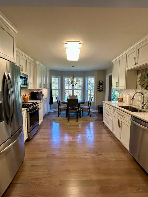 140 Washington Street Southeast Calhoun, GA 30701 - Photo 12 of 24 a kitchen with stainless steel appliances granite countertop a refrigerator stove microwave and sink