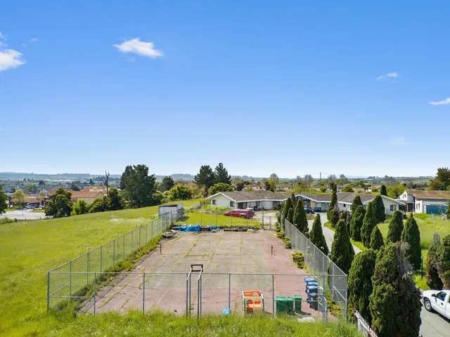 a front view of a residential houses with yard
