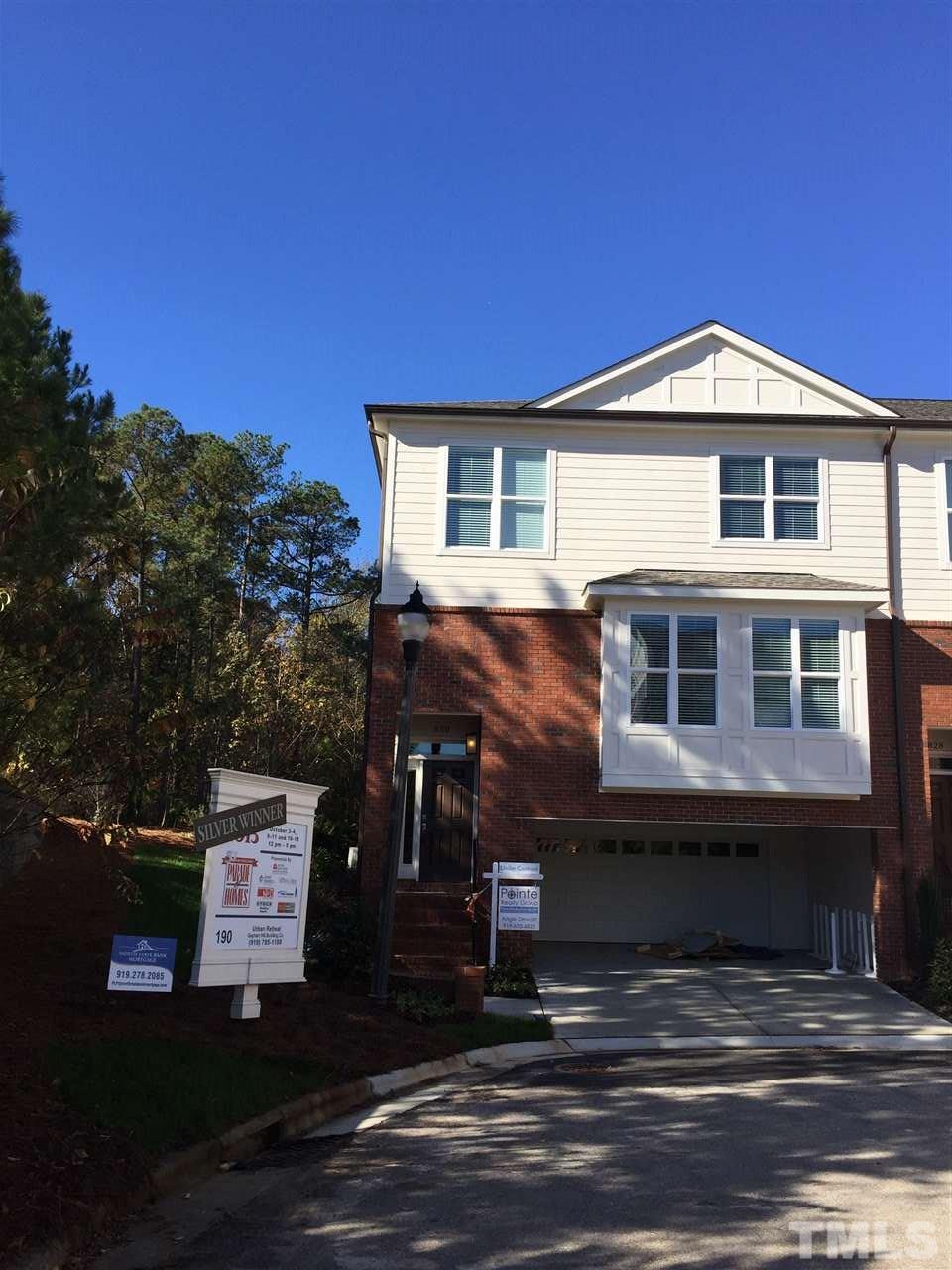 840 The Village Circle Raleigh, NC 27615 - Photo 1 of 17 a front view of a house with a yard