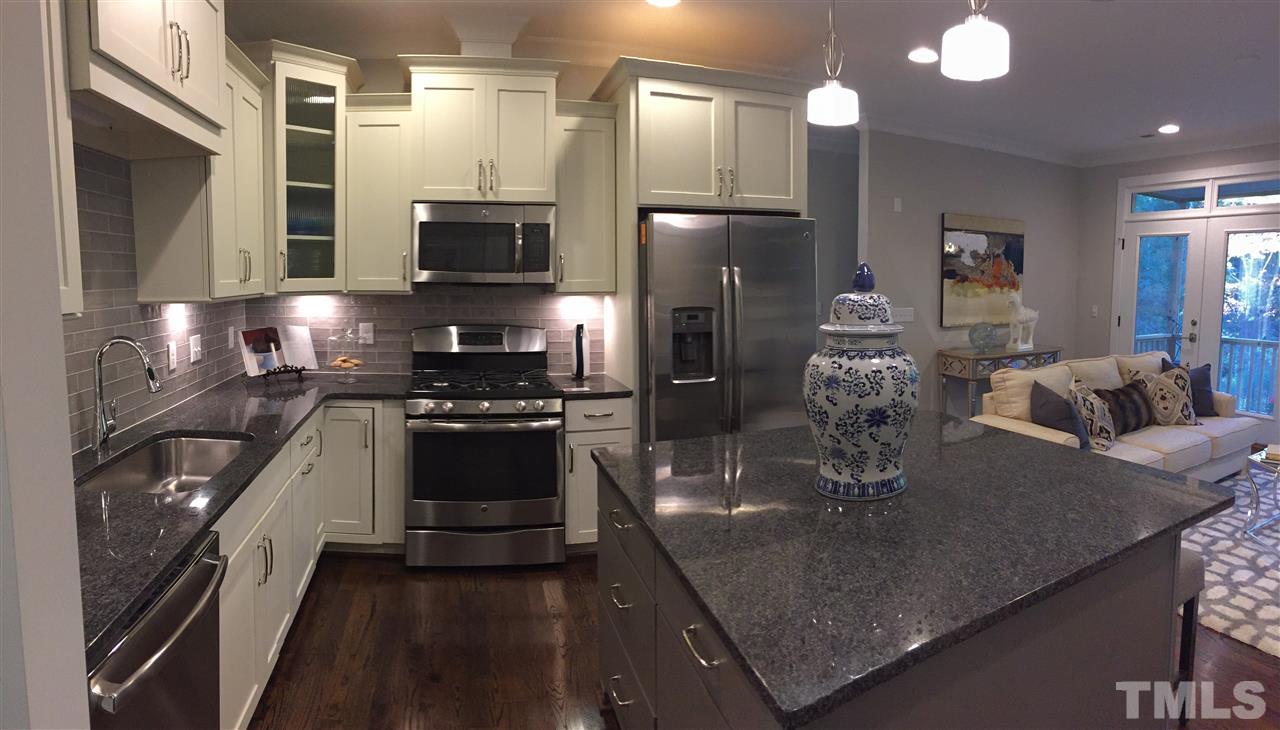 840 The Village Circle Raleigh, NC 27615 - Photo 6 of 17 a kitchen with a sink and refrigerator