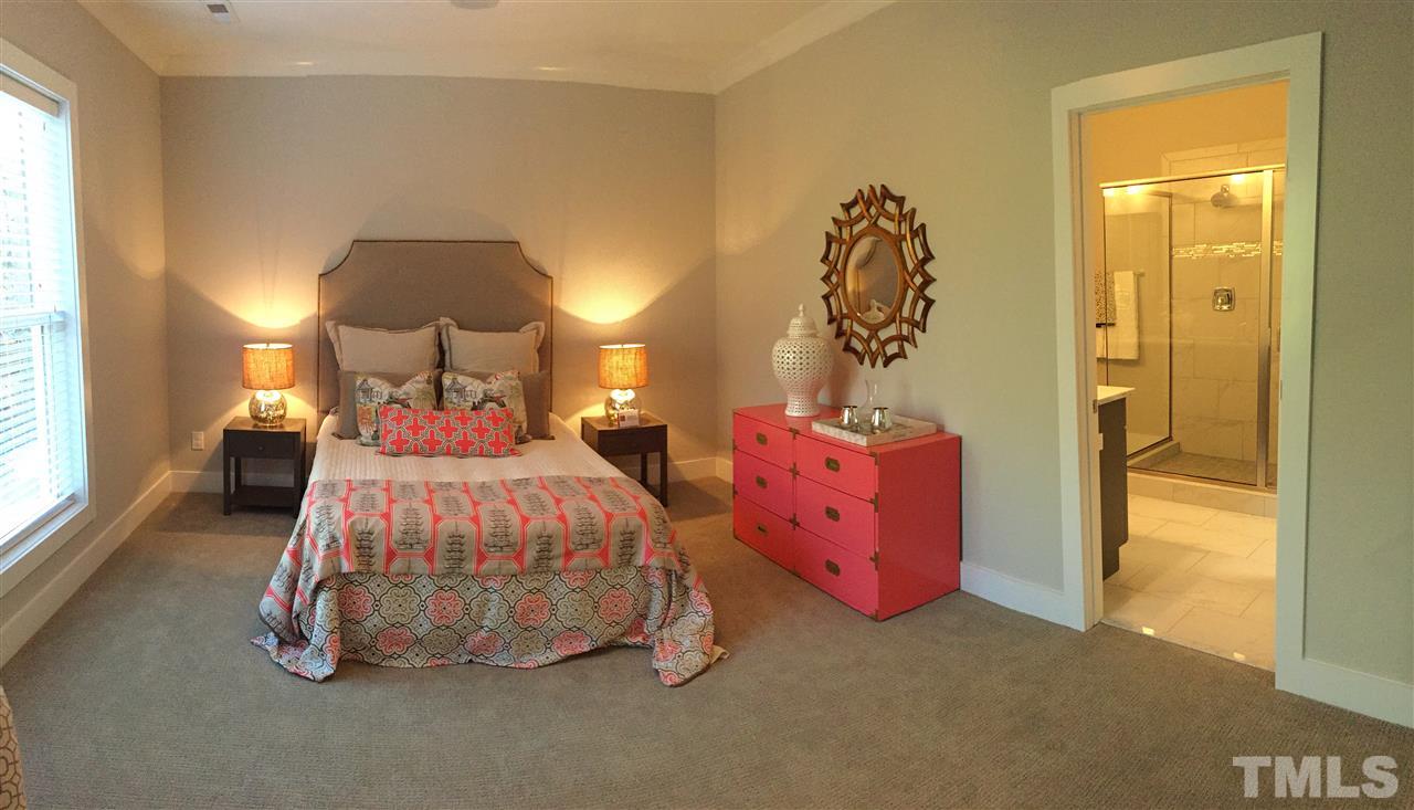 840 The Village Circle Raleigh, NC 27615 - Photo 10 of 17 a bedroom with a bed and a window