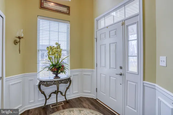 a view of a dining room with furniture and window