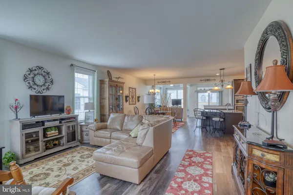 a living room with fireplace furniture and a flat screen tv