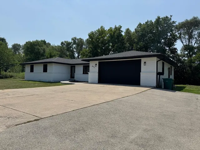 a front view of a house with a garage