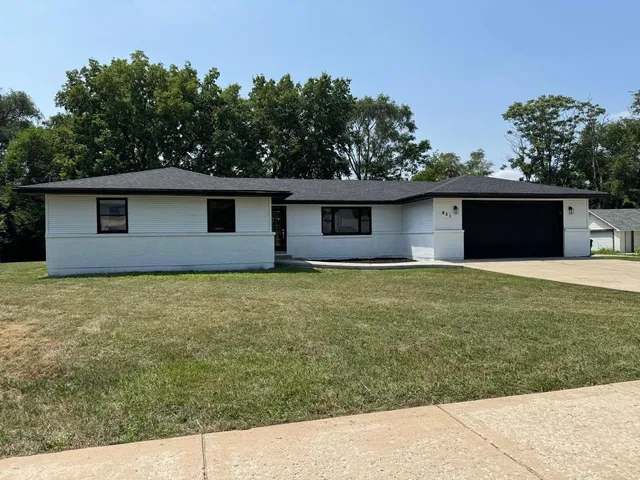a front view of a house with yard