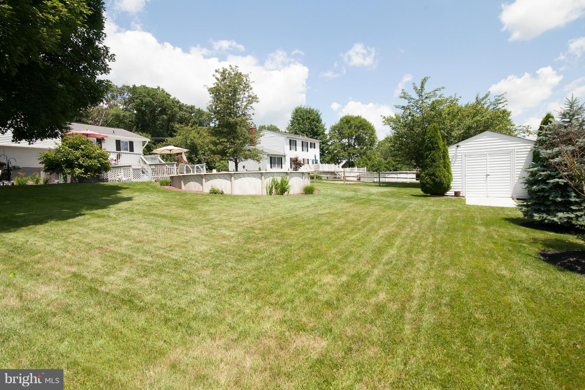 6151 Oklahoma Road Sykesville, MD 21784 - Photo 18 of 23 a view of a swimming pool with a yard
