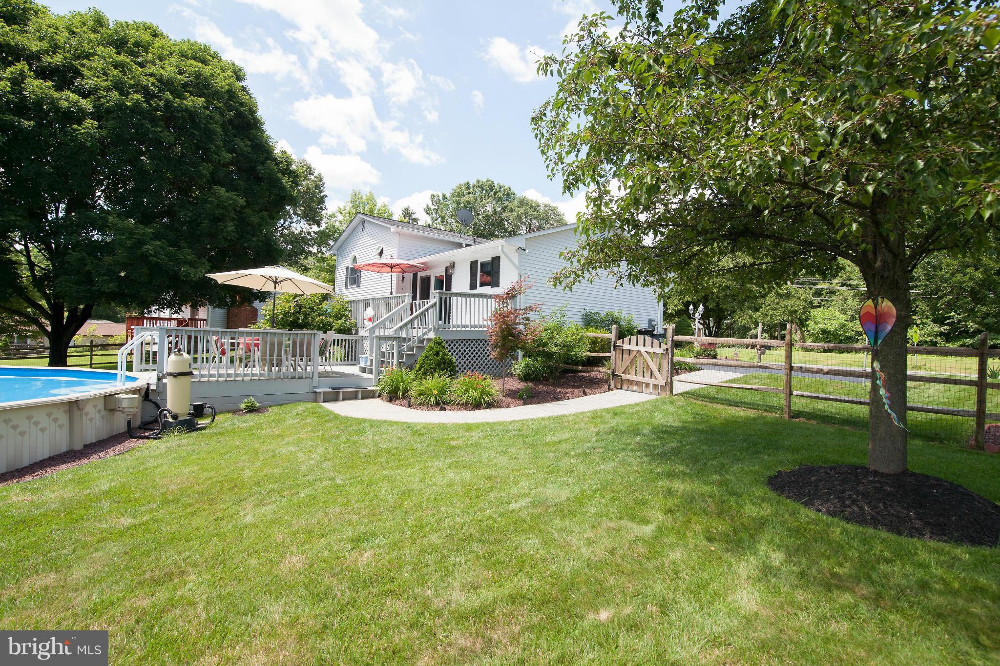 6151 Oklahoma Road Sykesville, MD 21784 - Photo 19 of 23 a view of a house with a yard porch and sitting area