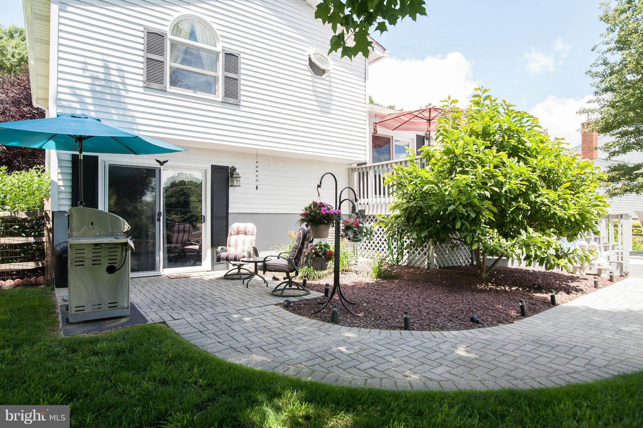 6151 Oklahoma Road Sykesville, MD 21784 - Photo 20 of 23 a view of a chair and table in backyard of the house