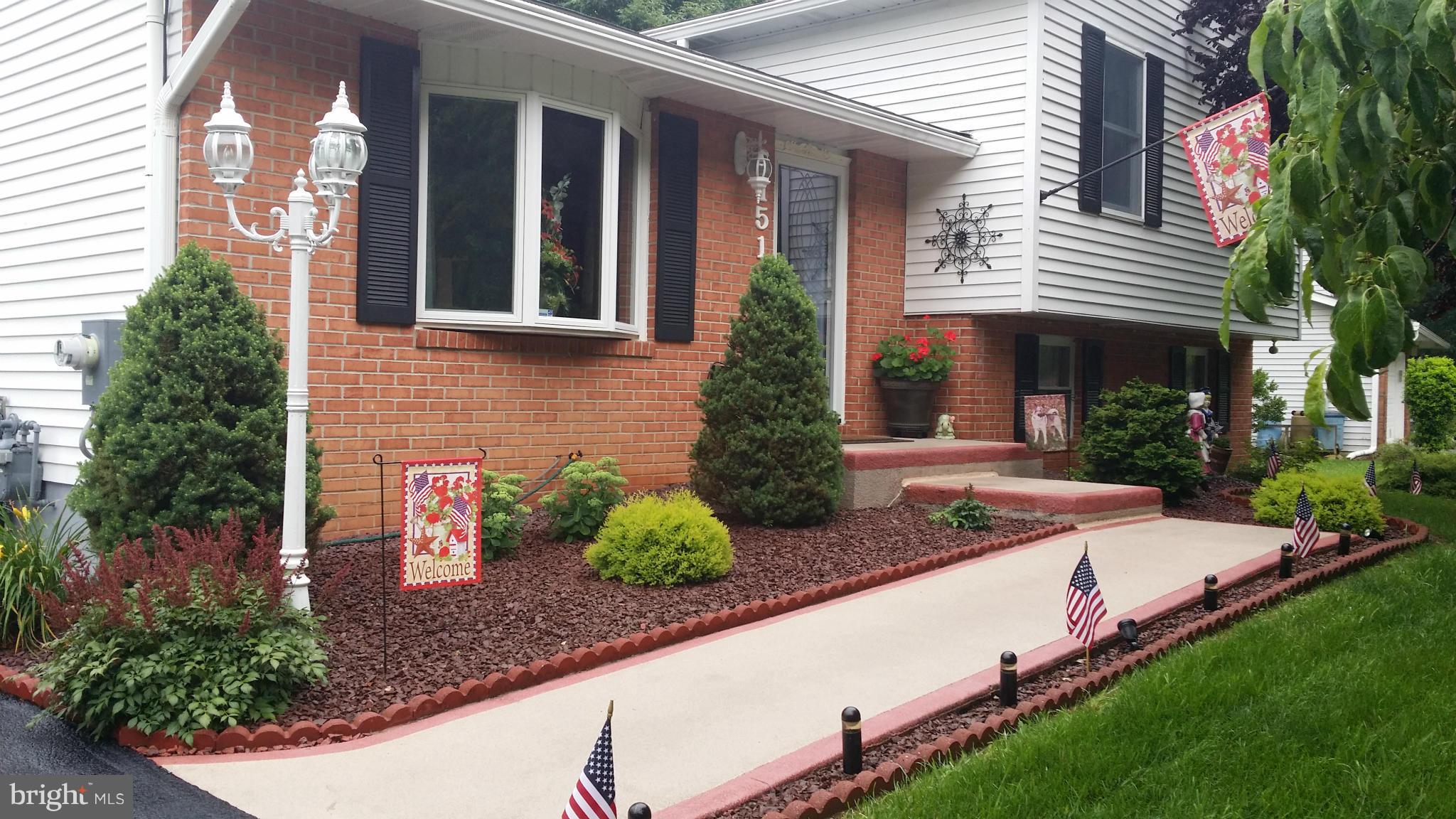 6151 Oklahoma Road Sykesville, MD 21784 - Photo 23 of 23 a front view of a house with garden