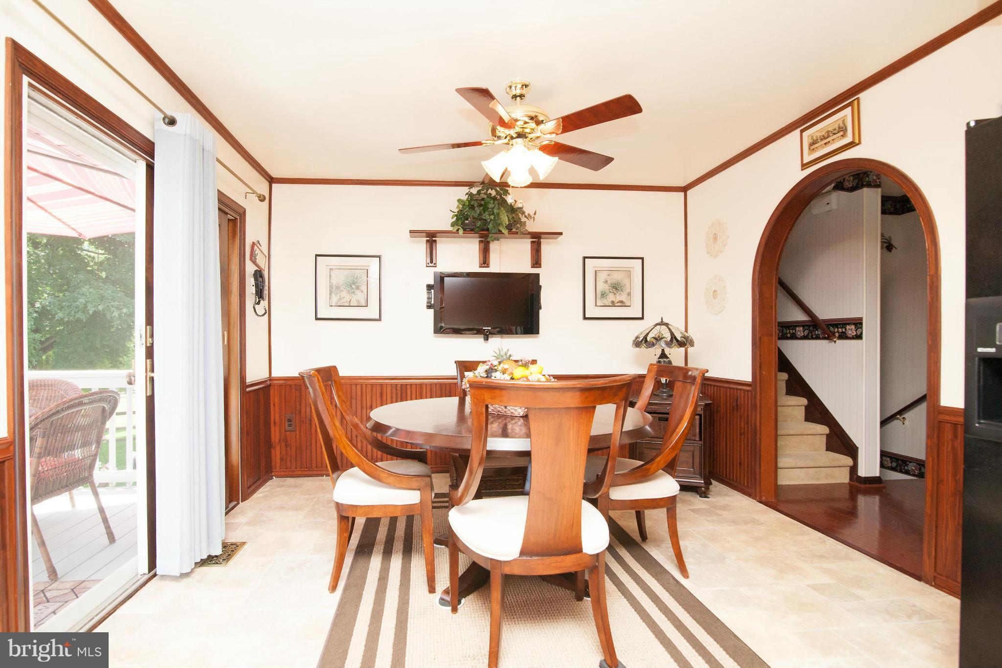 6151 Oklahoma Road Sykesville, MD 21784 - Photo 5 of 23 a view of a dining room with furniture window and wooden floor