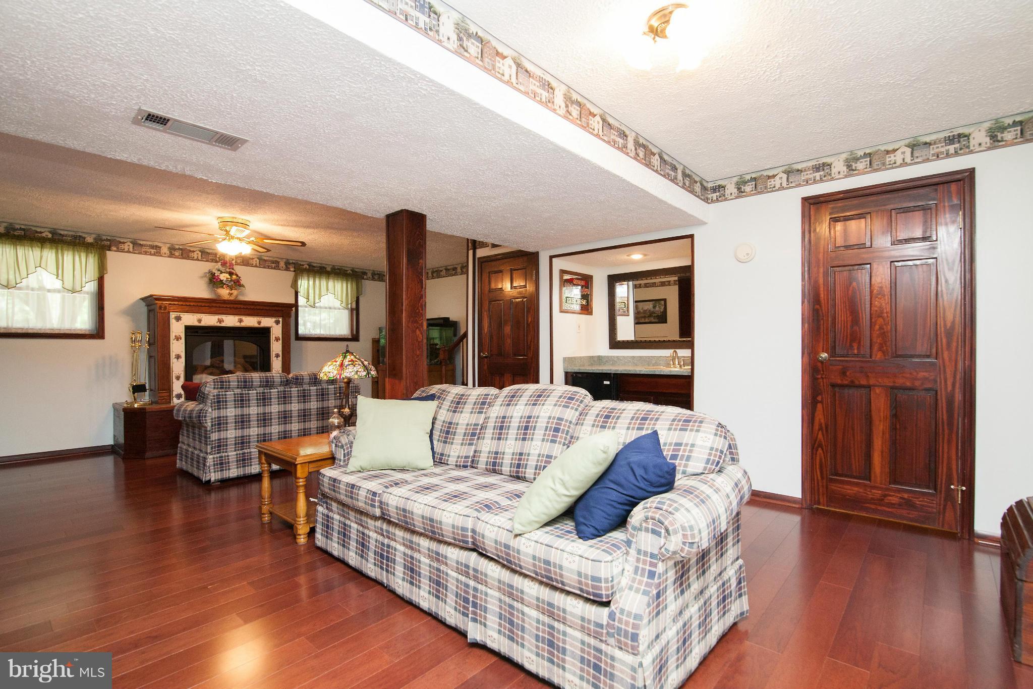 6151 Oklahoma Road Sykesville, MD 21784 - Photo 9 of 23 a living room with furniture and wooden floor