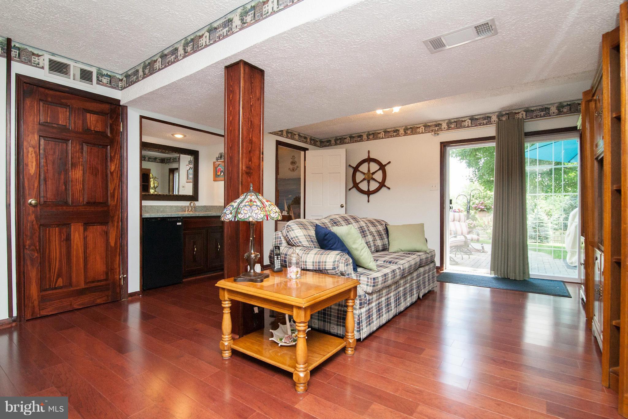 6151 Oklahoma Road Sykesville, MD 21784 - Photo 10 of 23 a living room with furniture and wooden floor