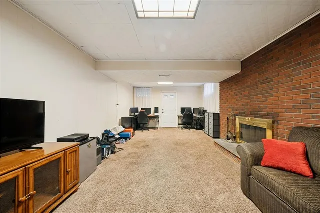 a large bedroom with a bed and a flat screen tv