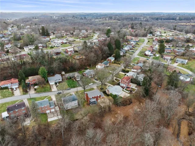 an aerial view of residential house with outdoor space