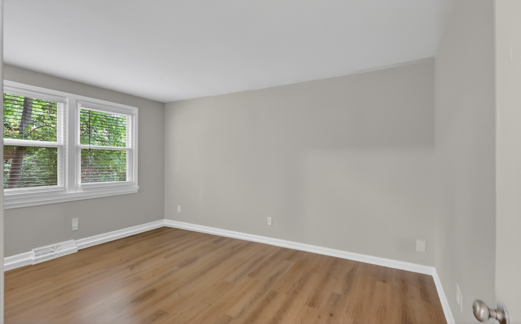 489 Canton Pass Madison, TN 37115 - Photo 12 of 25 an empty room with wooden floor and windows
