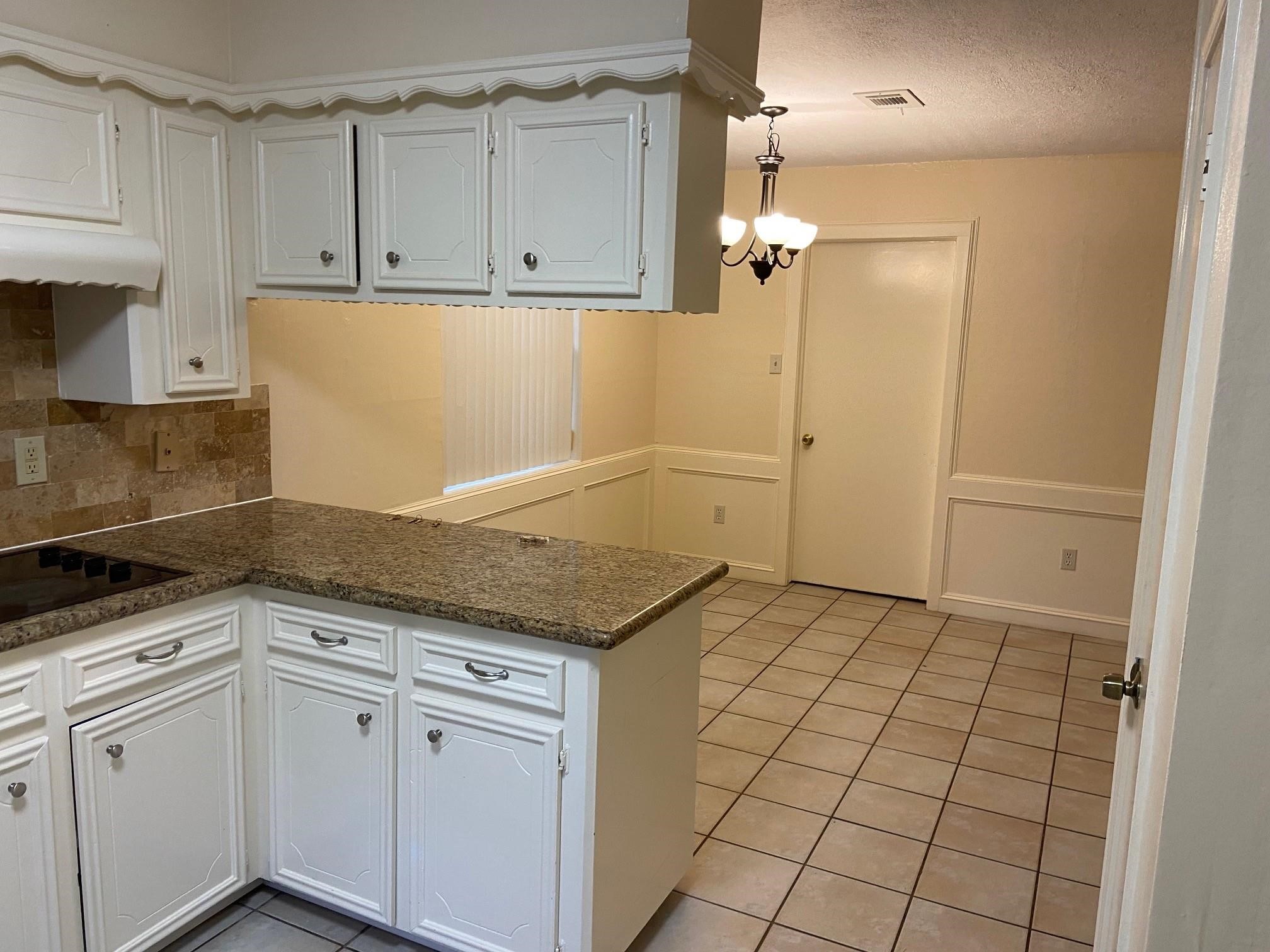 3418 Candlewisp Drive Spring, TX 77388 - Photo 6 of 16 a view of a kitchen with white cabinets