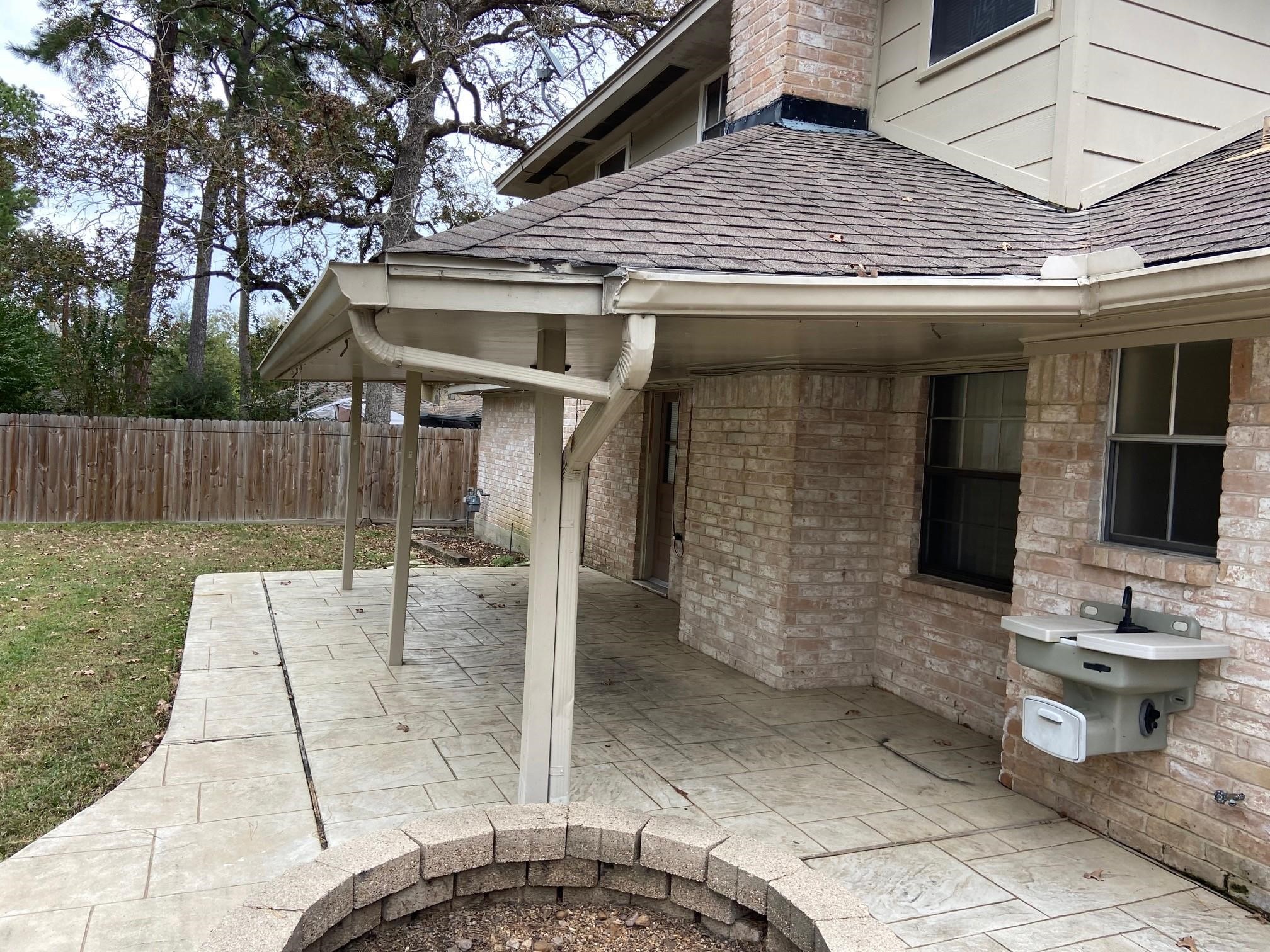 3418 Candlewisp Drive Spring, TX 77388 - Photo 10 of 16 a view of a patio with table and chairs with wooden fence and plants
