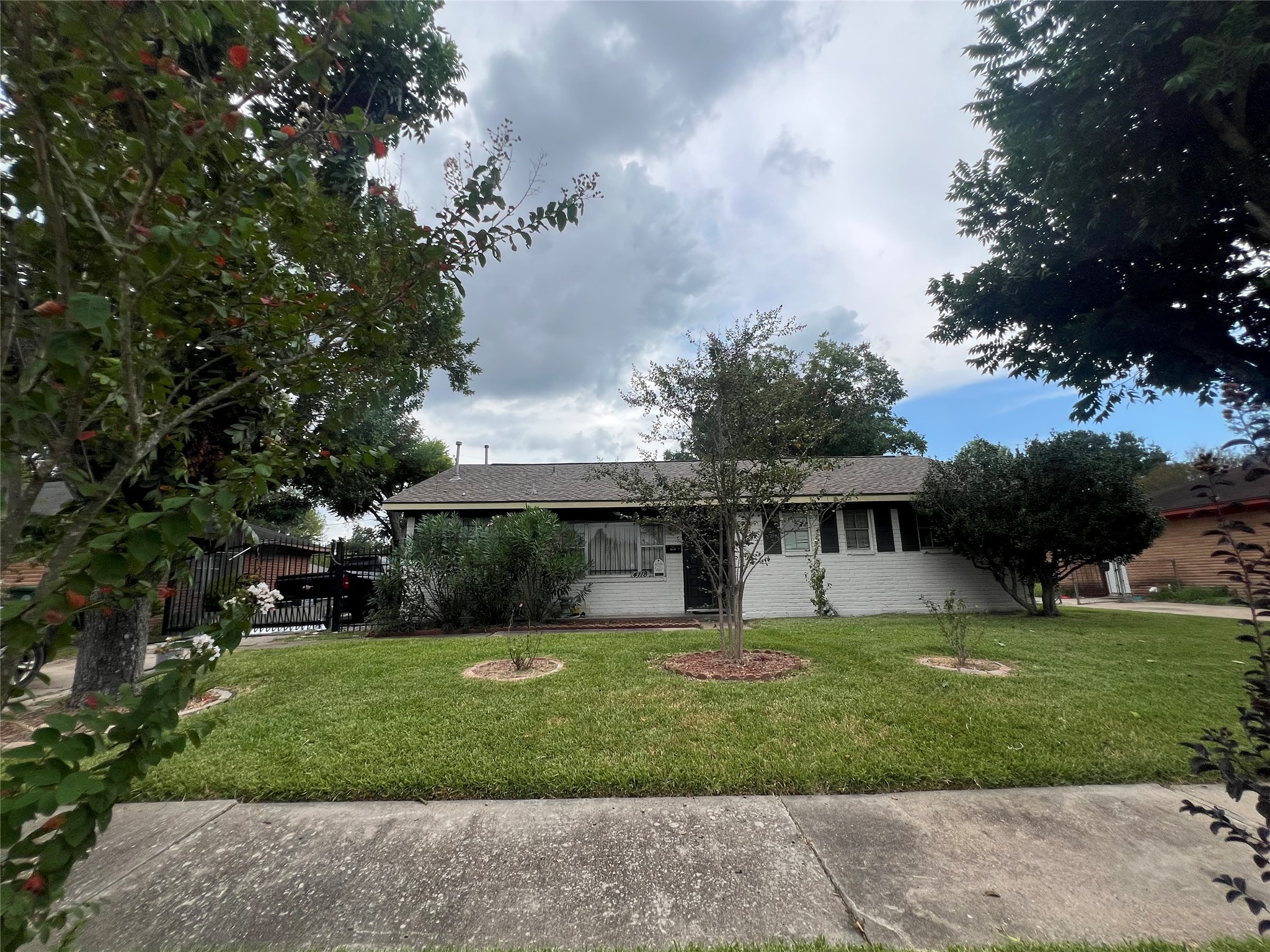 4118 Ebbtide Drive Houston, TX 77045 - Photo 9 of 14 a front view of house with yard and green space